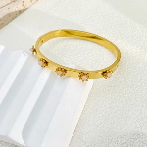 Elegant 18K gold-plated stainless steel sunflower bangle with pink stones on white stone