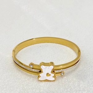 Elegant gold titanium steel bear bracelet featuring double layers and sparkling zircons