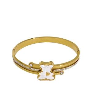 Golden titanium steel bear bangle featuring white enamel inlay and sparkling zircon crystals