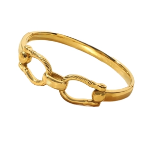 Minimalist gold-tone titanium steel bracelet with interlocking spiral textured rings
