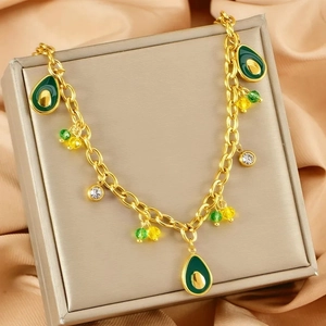 Golden stainless steel necklace featuring avocado fruit pendants with green beads