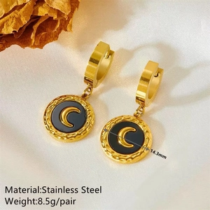 Detailed close-up of 14.3mm gold stainless steel hoop earrings with black crescent moon charm