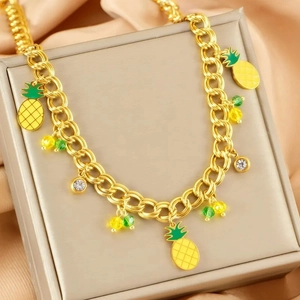 Gold chunky chain necklace featuring enamel pineapple charms and sparkling rhinestones