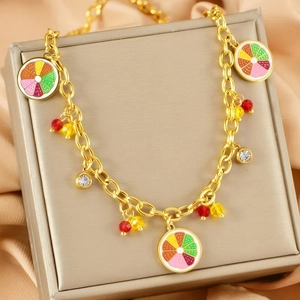 Gold chain necklace featuring colorful citrus enamel pendants and sparkling zircons