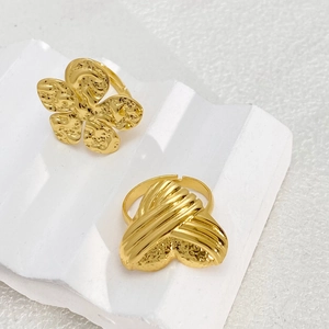 Adjustable golden titanium steel rings with textured floral and heart design