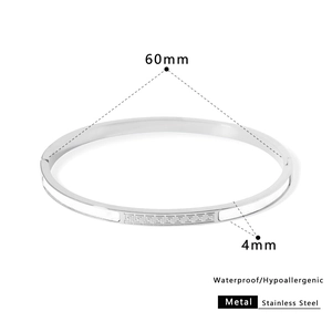 Silver stainless steel bangle with Greek key texture and 60mm inner diameter