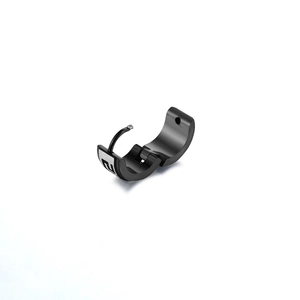 Detail of black stainless steel huggie earring showing open mechanism and silver engraving