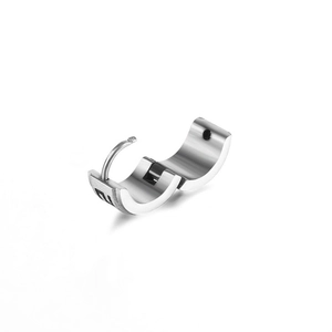 Close-up of silver steel huggie hoop earrings with brushed finish and S925 stamp