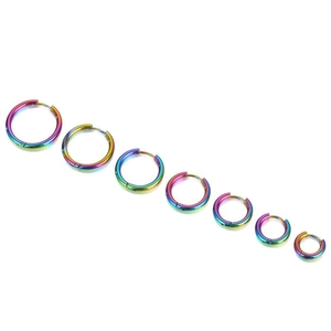 Detailed set of seven rainbow-colored stainless steel hoop earrings in various sizes