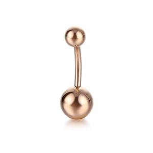 Close-up of polished rose gold curved barbell belly ring with high mirror finish