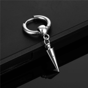 Macro detail of silver titanium steel hoop earring with a sleek conical pendant drop
