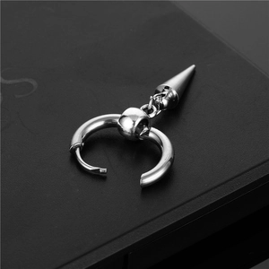 Detailed close-up of polished stainless steel hoop earrings with long cone pendant