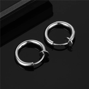 Polished silver stainless steel clip-on hoop earrings for non-pierced ears on black mirror