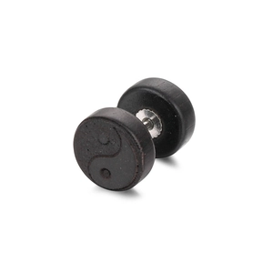 Macro shot of black wood yin yang stud earring with metallic screw back fastener