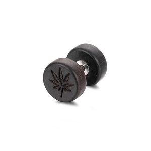 Macro detail of dark wood barbell stud earring featuring a carved maple leaf design