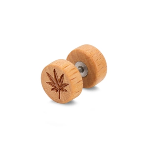 Macro detail of round wooden dumbbell earring with engraved seven-leaf plant pattern
