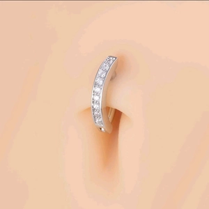 Titanium steel belly button ring with pavé cubic zirconia displayed on a model