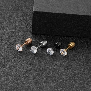 Macro view of four-prong round zircon stud earrings with screw-back in four metal finishes