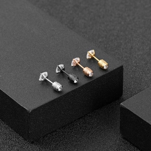 Macro shot of titanium steel stud earrings with 4-claw zircon and screw-back closure