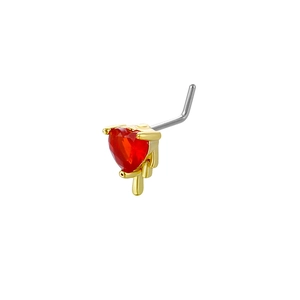 Macro detail of a 20G heart-shaped red zircon L-bar nose stud with gold wing design