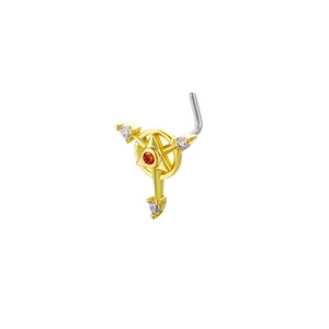 Detailed close-up of L-shaped gold nose stud with red center stone and white zircon accents