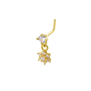 Macro detail of a 20G L-shaped gold nose stud featuring a sparkling star dangle with zircons