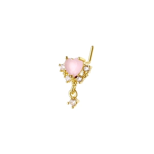 Detailed macro view of an L-shaped gold nose stud with heart pink gem and dangling charm