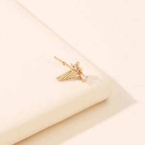 Star-shaped gold nose stud with zircons and a pear-shaped dangle pendant for women