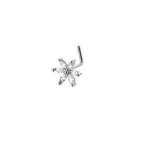 Detailed macro view of a silver L-shaped nose stud with a cubic zirconia flower petal design