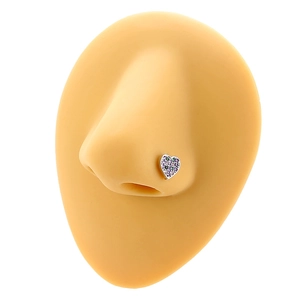 L-shaped heart nose stud with purple and green crystals on a nose model display