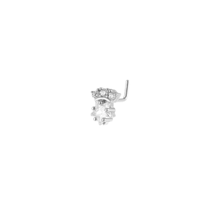 Macro view of silver star nose stud with sparkling cubic zirconia crown design