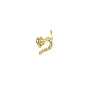 Detail view of a gold heart-shaped nose stud with L-shaped pin and sparkling zircon inlay