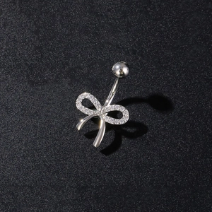 Polished silver butterfly belly ring with sparkling zircon stones on black background