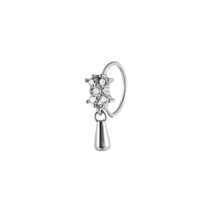 Detailed view of silver copper nose ring with zircon stones and hanging pendant
