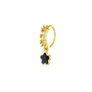 Detail of gold-plated nose ring with clear zircons and a black floral drop pendant
