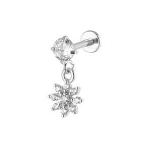 Macro view of silver snowflake pendant labret stud with white cubic zirconia inlay