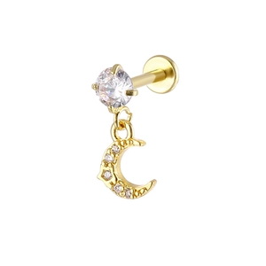 Detail of gold labret stud with crescent moon pendant and sparkling zircon stone