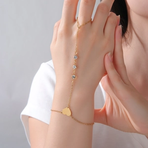 Elegant gold hand harness featuring star heart charms and round stones for women