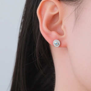 304 Stainless steel evil eye stud earrings with blue zirconia on female ear
