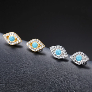 Macro shot of 304 stainless steel Evil Eye stud earrings with blue stones and crystals