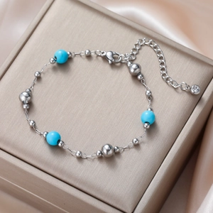 Detail of bohemian turquoise bead bracelet with lobster clasp and extension chain