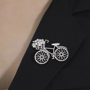 Creative silver bicycle flower brooch in stainless steel on a black suit lapel