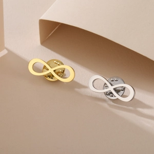 Vintage infinity symbol metal brooches in gold and silver finish with secure pin back