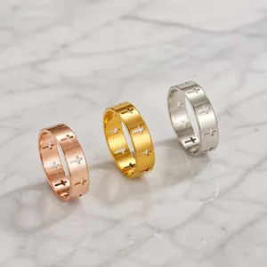 Polished stainless steel hollow cross rings in rose gold, gold, and silver finishes
