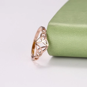 Detail view of rose gold Celtic knot ring showcasing intricate openwork geometry