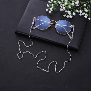 Elegant beaded gold metal eyewear chain with blue light blocking round glasses