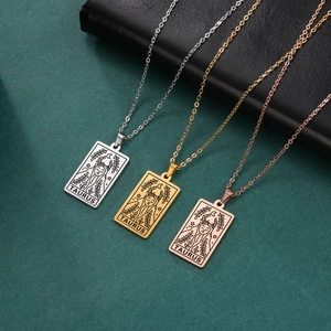 Detailed view of Taurus tarot card pendants in silver, gold, and rose gold finishes