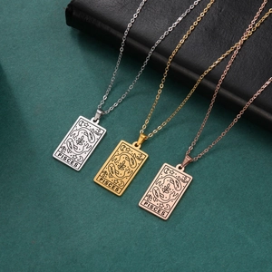 Macro detail of Pisces tarot necklaces in gold, silver, and rose gold stainless steel