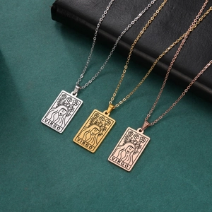 Close-up of three Virgo tarot card necklaces in silver, gold, and rose gold finishes