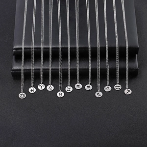 Collection of 12 silver zodiac sign round hollow pendants on elegant chain necklaces
